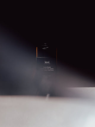 kirri fragrance oil bottle in a beam of light