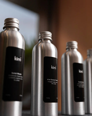 row of kirri aura oils by a window