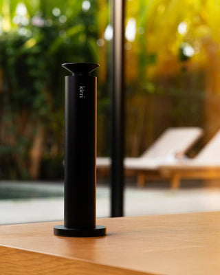 kirri beacon diffuser on a table by the pool