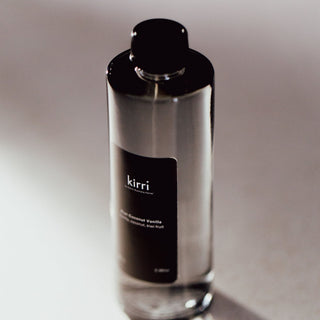 kirri kiwi coconut vanilla aura fragrance oil in warm light