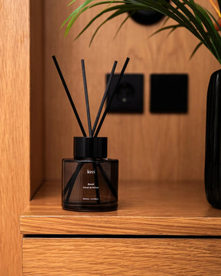 kirri reed diffuser on a timber cabinet