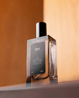 kirri room spray on a timber ledge in warm light