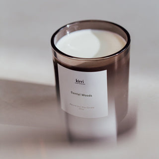 kirri santal woods soy wax candle in soft light