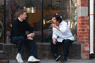 andrew and polin sharing a coffee outside makara's studio in richmond