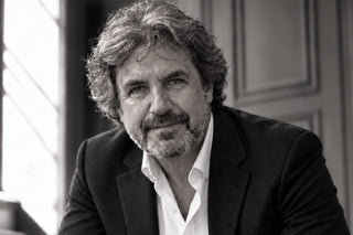 master perfumer rené morgenthaler in a dark suit, black and white portrait